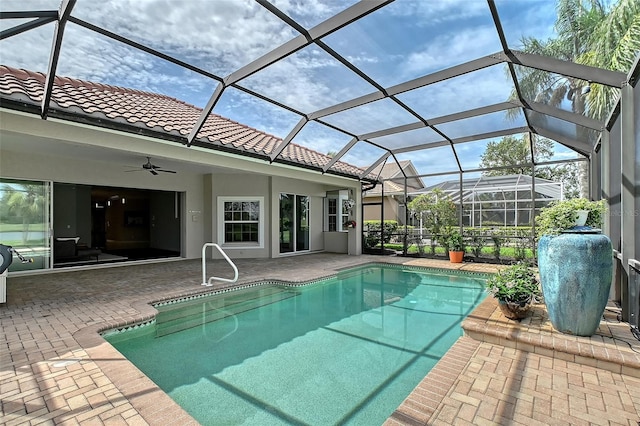 7868 Chick Evans Pl, Sarasota, FL 34240 - swimming pool with a ceiling fan, a patio, and glass enclosure