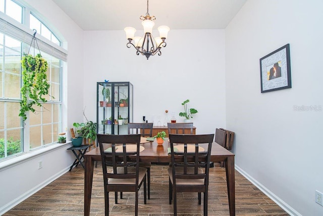 572 Sparrow Branch Cir, Saint Johns, FL 32259 - dining room featuring dark wood-style floors and a chandelier