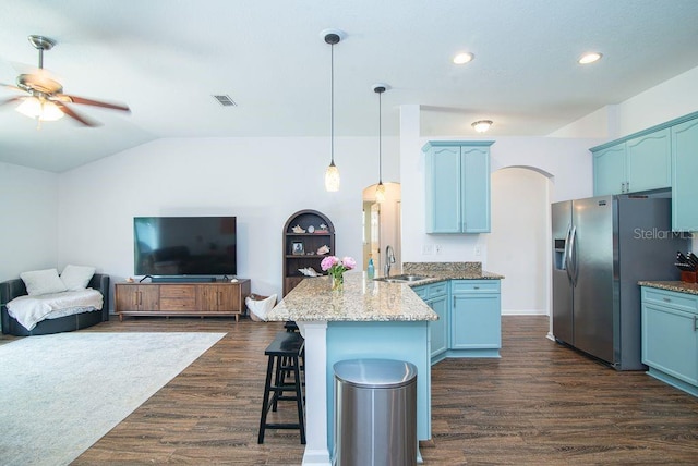 572 Sparrow Branch Cir, Saint Johns, FL 32259 - kitchen with a peninsula, stainless steel fridge, a kitchen breakfast bar, dark wood-style floors, and ceiling fan