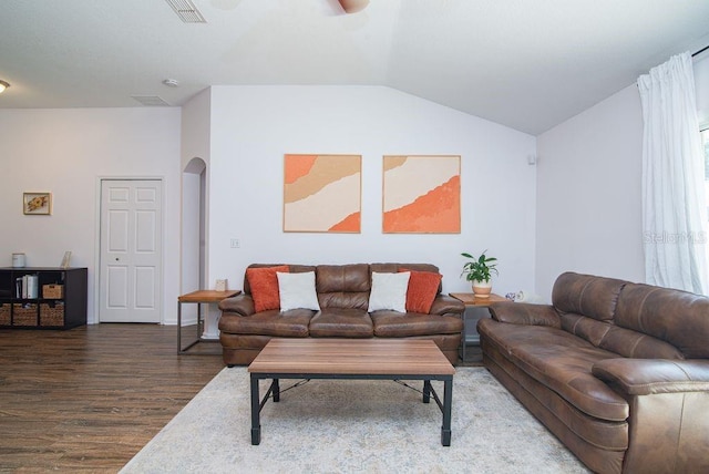 572 Sparrow Branch Cir, Saint Johns, FL 32259 - living area with arched walkways, wood finished floors, vaulted ceiling, and a ceiling fan