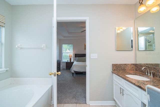 572 Sparrow Branch Cir, Saint Johns, FL 32259 - bathroom with connected bathroom, vanity, and a garden tub