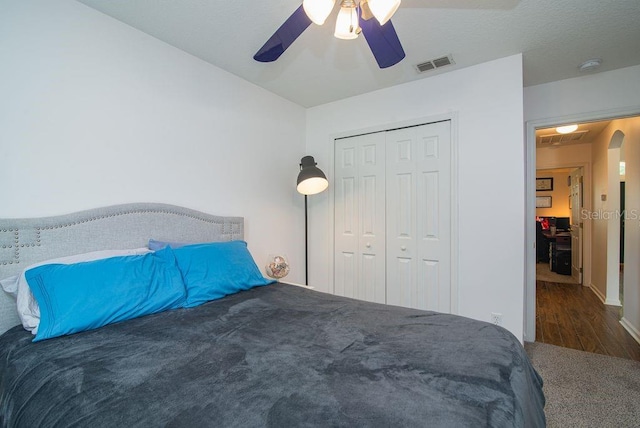572 Sparrow Branch Cir, Saint Johns, FL 32259 - bedroom with a closet, a ceiling fan, carpet, and arched walkways