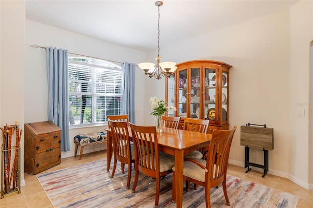 5242 Abdella Ln, North Port, FL 34291 - dining area with light tile patterned flooring and a chandelier