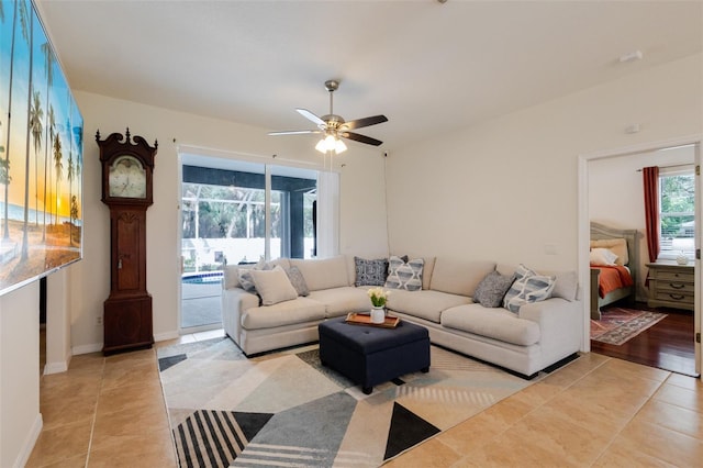 5242 Abdella Ln, North Port, FL 34291 - living area with a ceiling fan and light tile patterned floors