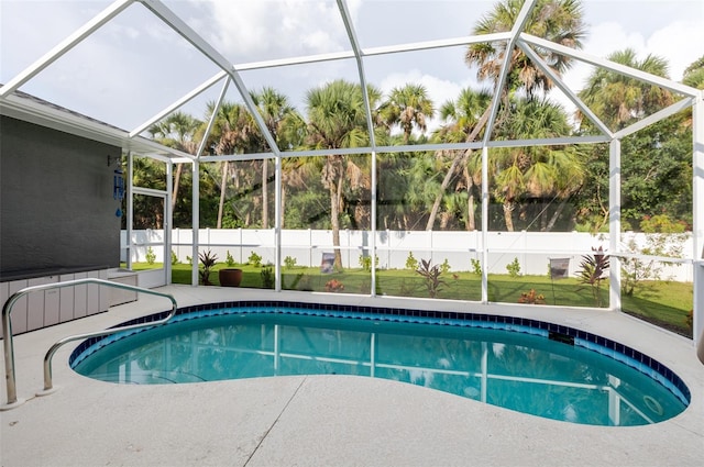 5242 Abdella Ln, North Port, FL 34291 - view of swimming pool with glass enclosure and a fenced backyard