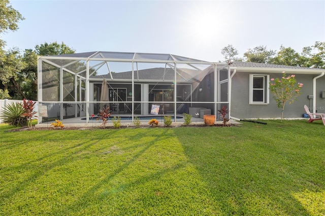 5242 Abdella Ln, North Port, FL 34291 - rear view of house featuring a lawn, stucco siding, an outdoor pool, a patio area, and glass enclosure