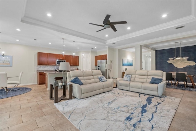 12215 Goldenrod Ave, Bradenton, FL 34212 - living area with ceiling fan, a tray ceiling, and recessed lighting