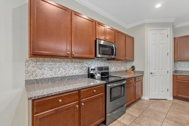 12215 Goldenrod Ave, Bradenton, FL 34212 - kitchen featuring appliances with stainless steel finishes, tasteful backsplash, ornamental molding, brown cabinetry, and dark stone counters
