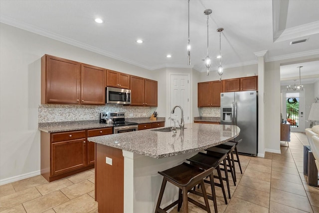12215 Goldenrod Ave, Bradenton, FL 34212 - kitchen featuring stainless steel appliances, backsplash, a breakfast bar area, light stone counters, and light tile patterned flooring