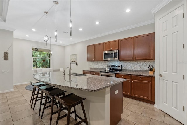 12215 Goldenrod Ave, Bradenton, FL 34212 - kitchen featuring stainless steel appliances, backsplash, a kitchen island with sink, dark stone countertops, and recessed lighting