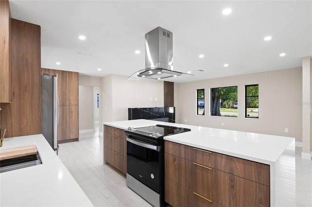 3136 Webber St, Sarasota, FL 34239 - kitchen with appliances with stainless steel finishes, modern cabinets, island exhaust hood, light countertops, and recessed lighting