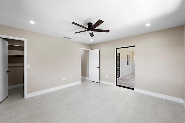 3136 Webber St, Sarasota, FL 34239 - unfurnished bedroom with recessed lighting, a spacious closet, light wood-style floors, ceiling fan, and a closet