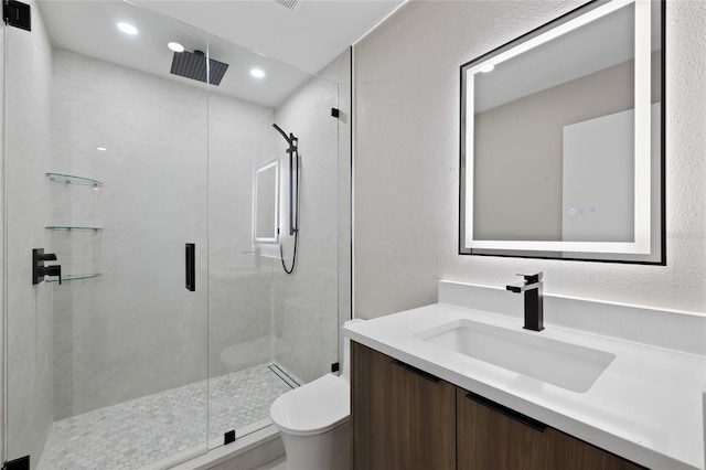 3136 Webber St, Sarasota, FL 34239 - full bath with vanity, a stall shower, a textured wall, and recessed lighting