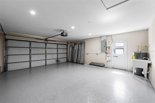3136 Webber St, Sarasota, FL 34239 - garage featuring a garage door opener and electric panel