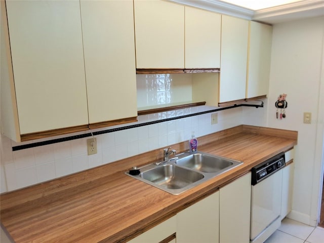 515 30th Ave W Unit H401, Bradenton, FL 34205 - kitchen with white dishwasher, tasteful backsplash, and wood counters