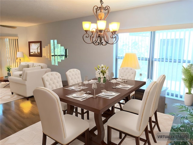 515 30th Ave W Unit H401, Bradenton, FL 34205 - dining area featuring healthy amount of natural light, a chandelier, and wood finished floors