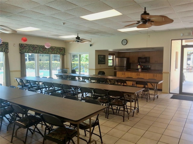 515 30th Ave W Unit H401, Bradenton, FL 34205 - dining space with ceiling fan, light tile patterned flooring, and a drop ceiling