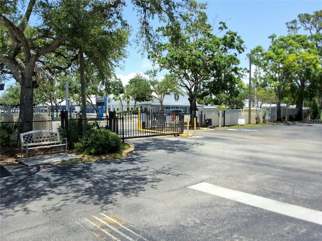 515 30th Ave W Unit H401, Bradenton, FL 34205 - view of asphalt road featuring a gate