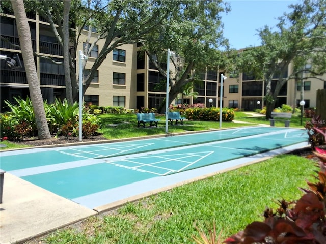 515 30th Ave W Unit H401, Bradenton, FL 34205 - view of home's community with a yard and shuffleboard
