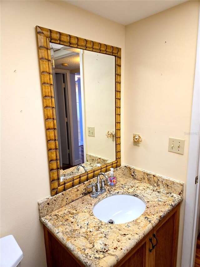 515 30th Ave W Unit H401, Bradenton, FL 34205 - half bathroom with vanity and toilet
