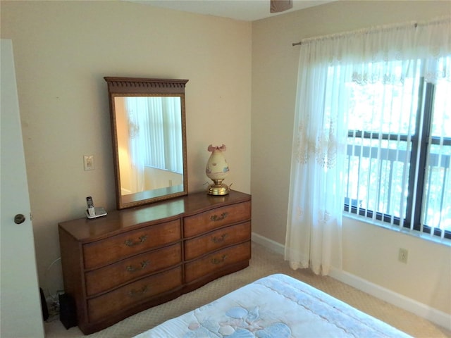515 30th Ave W Unit H401, Bradenton, FL 34205 - bedroom with carpet floors and baseboards