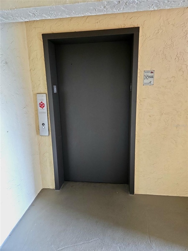 515 30th Ave W Unit H401, Bradenton, FL 34205 - property entrance with elevator and stucco siding