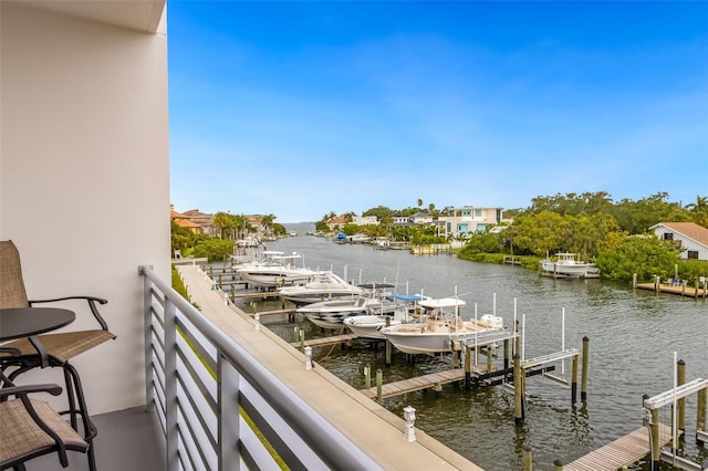 1709 N Tamiami Trl Unit A313, Sarasota, FL 34234 - dock featuring a water view, boat lift, and a balcony