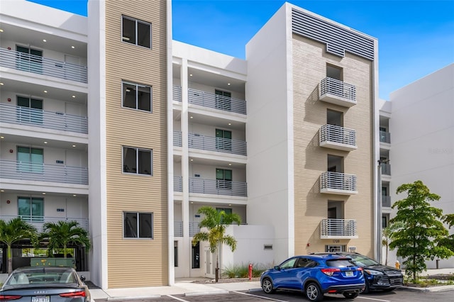 1709 N Tamiami Trl Unit A313, Sarasota, FL 34234 - view of apartment building / complex featuring uncovered parking