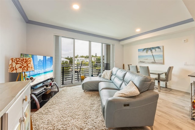 1709 N Tamiami Trl Unit A313, Sarasota, FL 34234 - living room with crown molding, light wood finished floors, and recessed lighting