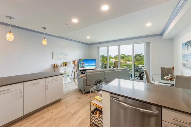 1709 N Tamiami Trl Unit A313, Sarasota, FL 34234 - kitchen with stainless steel dishwasher, dark countertops, white cabinets, light wood-style flooring, and pendant lighting