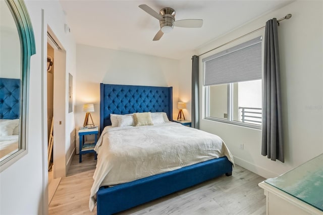 1709 N Tamiami Trl Unit A313, Sarasota, FL 34234 - bedroom with light wood-style floors and a ceiling fan