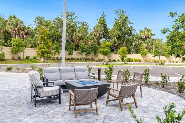 1709 N Tamiami Trl Unit A313, Sarasota, FL 34234 - view of patio with an outdoor living space with a fire pit