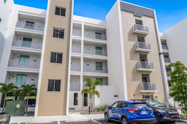 1709 N Tamiami Trl Unit A313, Sarasota, FL 34234 - view of apartment building / complex featuring uncovered parking