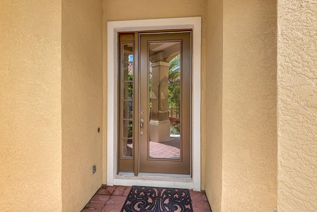 7314 Wexford Ct, Lakewood Ranch, FL 34202 - doorway to property featuring stucco siding