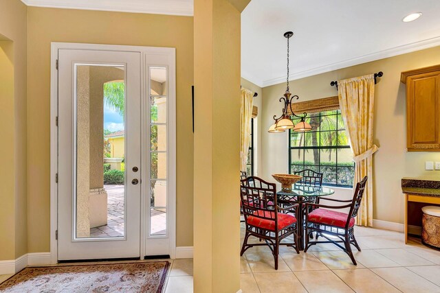 7314 Wexford Ct, Lakewood Ranch, FL 34202 - entryway featuring crown molding, light tile patterned floors, and recessed lighting