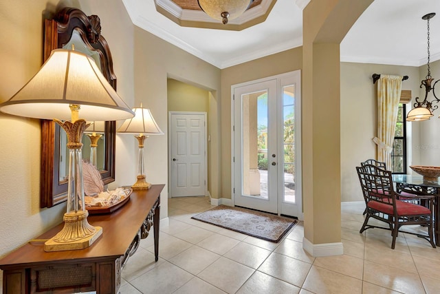 7314 Wexford Ct, Lakewood Ranch, FL 34202 - entrance foyer featuring light tile patterned flooring, crown molding, and french doors