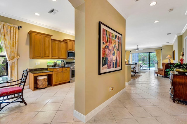 7314 Wexford Ct, Lakewood Ranch, FL 34202 - hallway featuring crown molding, light tile patterned floors, and recessed lighting