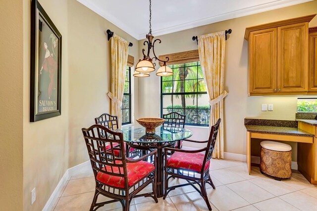 7314 Wexford Ct, Lakewood Ranch, FL 34202 - dining space with ornamental molding and light tile patterned floors