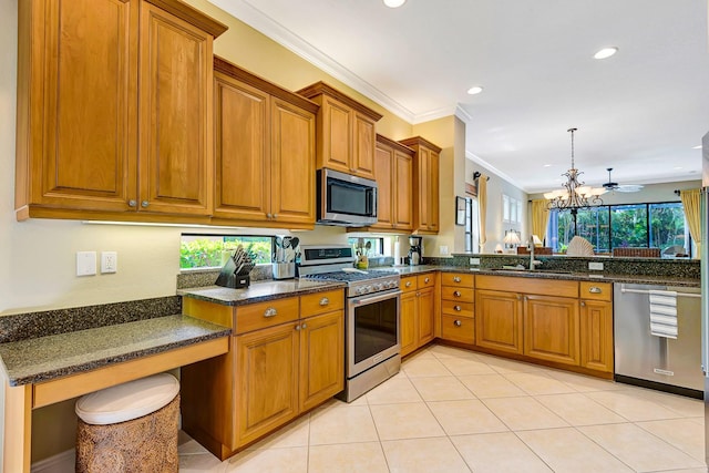 7314 Wexford Ct, Lakewood Ranch, FL 34202 - kitchen featuring stainless steel appliances, brown cabinets, recessed lighting, a chandelier, and dark stone counters