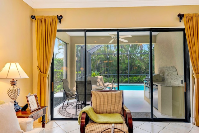 7314 Wexford Ct, Lakewood Ranch, FL 34202 - sitting room with a sunroom, ceiling fan, tile patterned floors, and ornamental molding