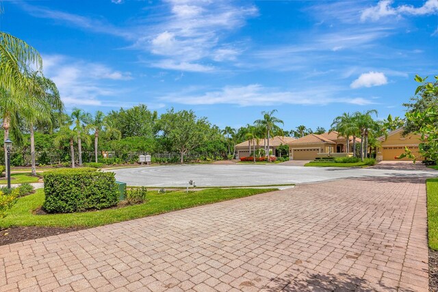 7314 Wexford Ct, Lakewood Ranch, FL 34202 - view of community with curved driveway and a garage