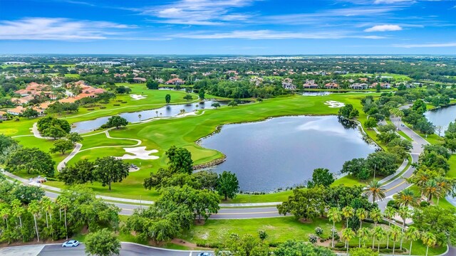 7314 Wexford Ct, Lakewood Ranch, FL 34202 - aerial perspective of suburban area featuring a golf course and a nearby body of water