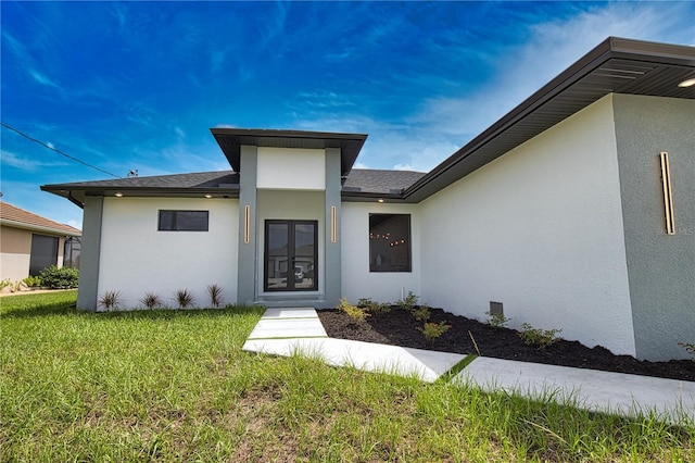 366 Fordham Rd, Venice, FL 34293 - entrance to property with stucco siding and a lawn