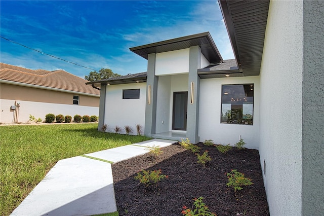 366 Fordham Rd, Venice, FL 34293 - property entrance featuring stucco siding and a lawn