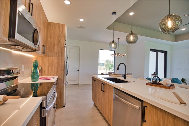 366 Fordham Rd, Venice, FL 34293 - kitchen with appliances with stainless steel finishes, modern cabinets, brown cabinets, and recessed lighting