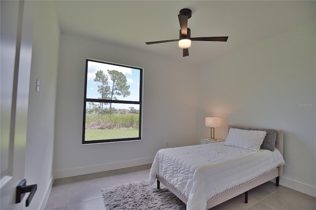 366 Fordham Rd, Venice, FL 34293 - tiled bedroom with baseboards and a ceiling fan