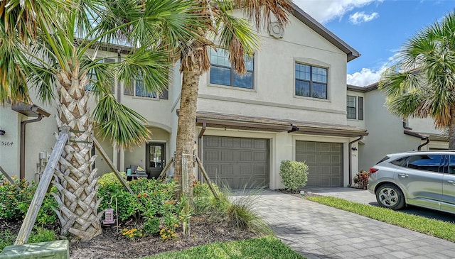 15160 Lyla Ter, Bradenton, FL 34211 - view of property featuring stucco siding, an attached garage, and driveway