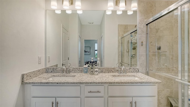 15160 Lyla Ter, Bradenton, FL 34211 - bathroom with double vanity and a shower stall