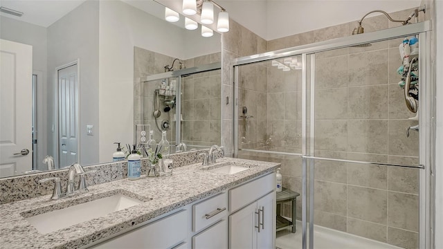 15160 Lyla Ter, Bradenton, FL 34211 - full bathroom featuring double vanity and a shower stall