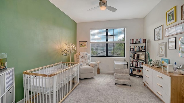 15160 Lyla Ter, Bradenton, FL 34211 - bedroom with light carpet, a crib, and a ceiling fan